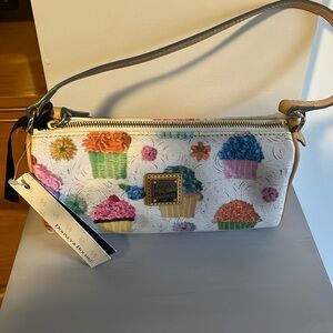 Small Dooney and Bourke barrel bag with cupcake design